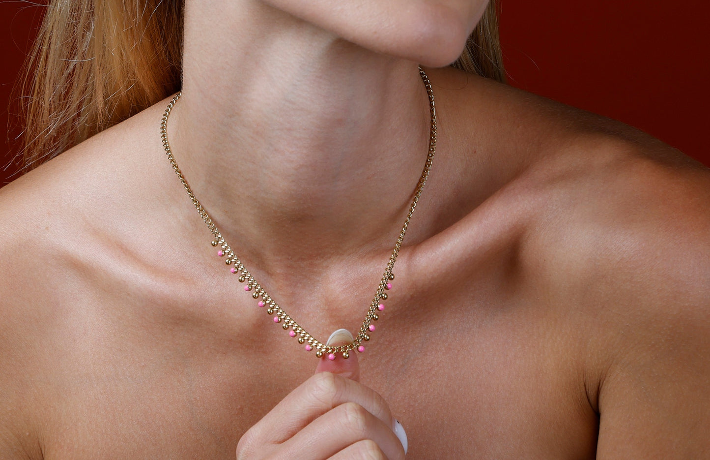 close up on model barbie pink drop oil bead choker necklace, gold and pink 